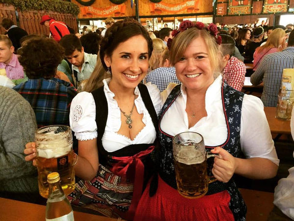 women at the spring volksfest in munich wearing german traditional dress