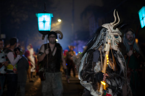 people dressed as krampus in a krampus parade