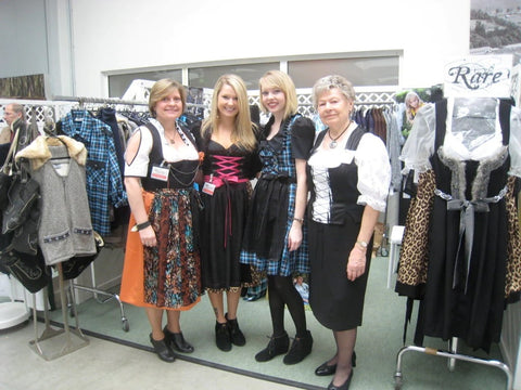 group of women wearing traditional bavarian dirndl dresses