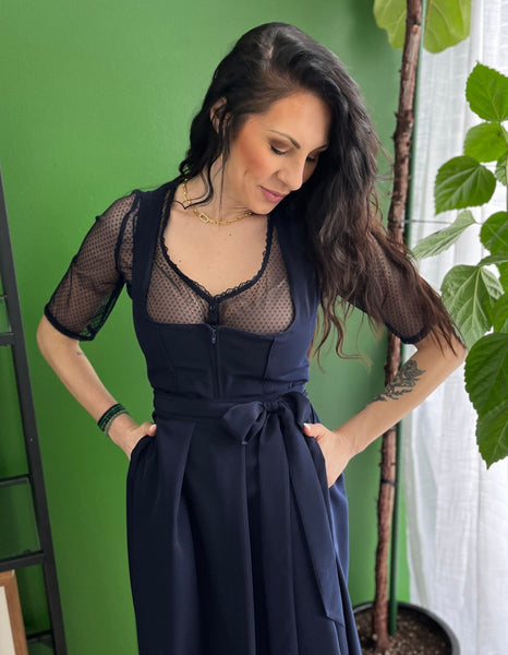 Woman wearing a navy dirndl blouse perfect for a traditional oktoberfest costume