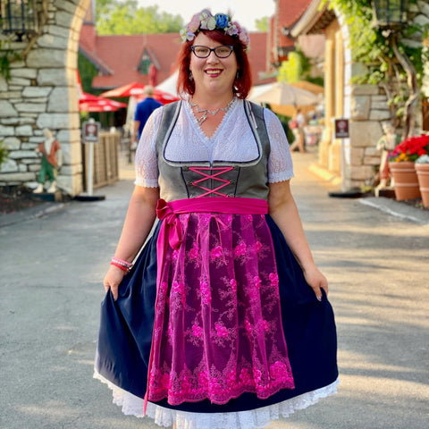 woman wearing a floral crown and a plus size dirndl dress at a local oktoberfest event