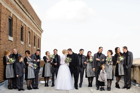 Wedding photo of bride and groom and wedding party in traditional garments like German dirndl dresses