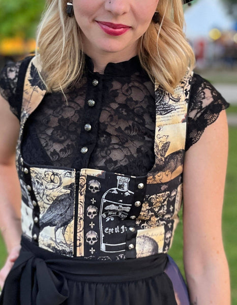 woman wearing a black cap sleeve dirndl blouse with a modern Dirndl at Oktoberfest