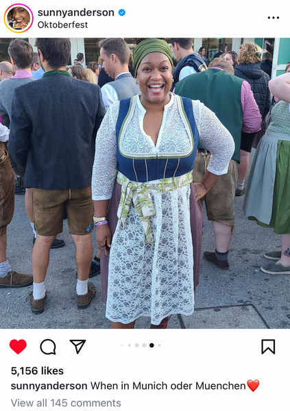 Food Network star, Sunny Anderson wearing a Rare Dirndl at oktoberfest with a knee length skirt, white blouse and a great accessories