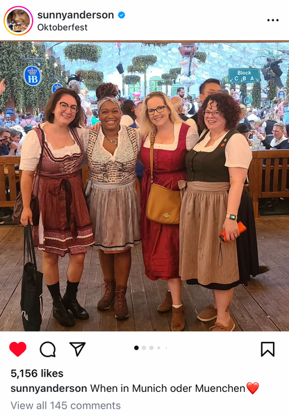 group of women wearing tradidional oktoberfest costumes at oktoberfest in munich incluing short and long skirts. Some at knee length and some longer with socks