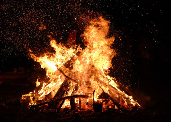 A bonfire lighting up the night sky during one of the pagan celebrations