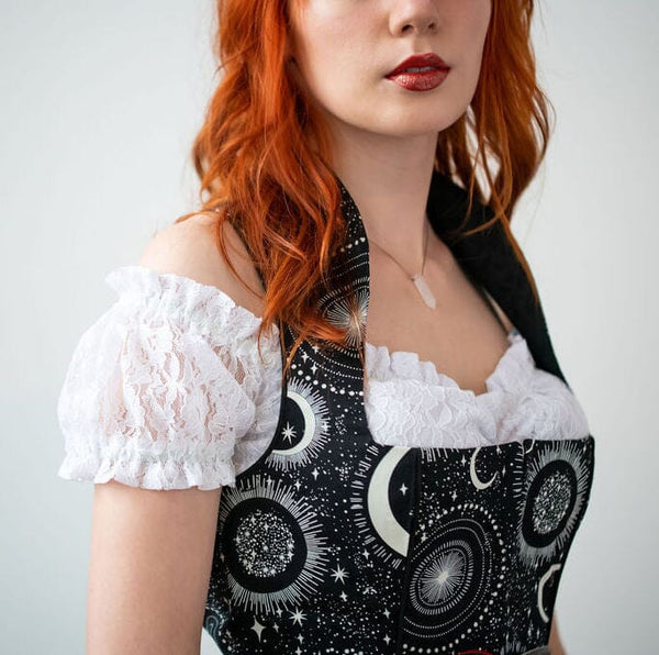 woman wearing german womens clothing with an off the shoulder dirndl blouse