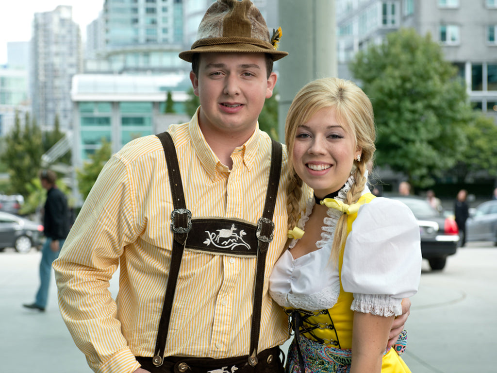 jenette mccurdy on the set of the movie swindle wearing a yellow dirndl with white dirndl blouse