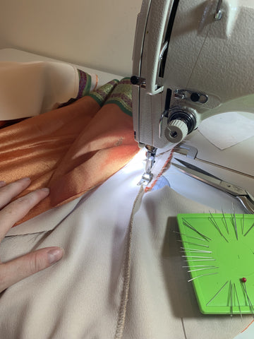 image of the oktoberfest dress pockets being sewn. These are sewn into the right side and left side to enhance the functionality of the oktoberfest costume