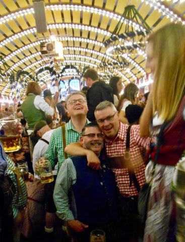 photos of people dancing and having fun at oktoberfest a p[opular beer festival in munich germany