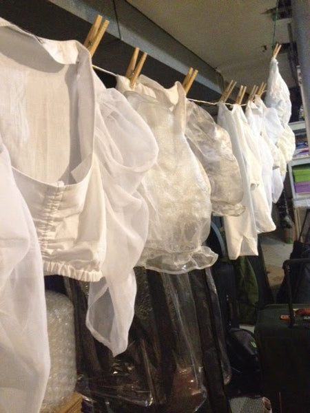 dirndl blouses hanging to dry on a clothes line
