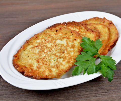 a plate of crisy potato pancakes at oktoberfest