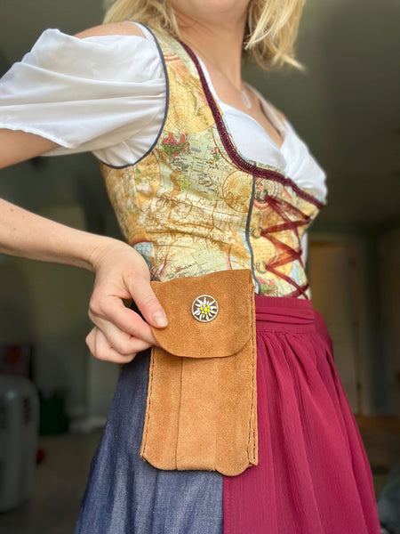 Woman in a dirndl with a suede apron purse. Great bag for Oktoberfest.