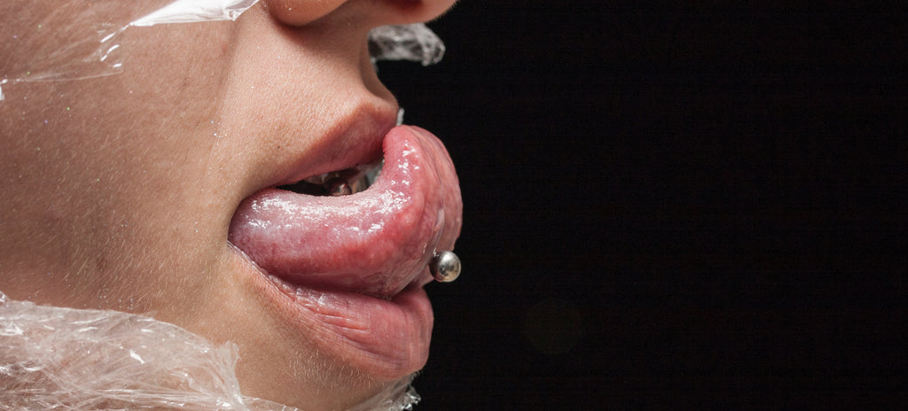 A new tongue piercing that has been conducted in a professional and hygienic environment.