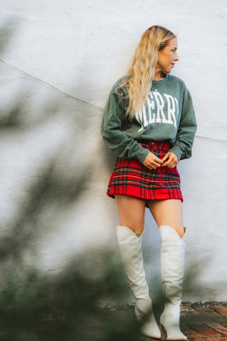 Cute Christmas sweatshirt and red plaid skort from Lush Fashion Lounge women's boutique in Oklahoma City