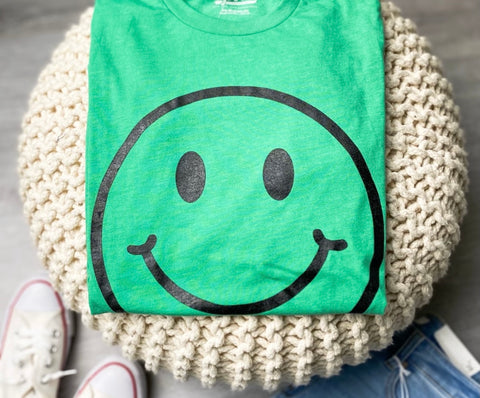 Green smiley face t-shirt from chevytahoeatlanta women's boutique in 7152 AH Eibergen