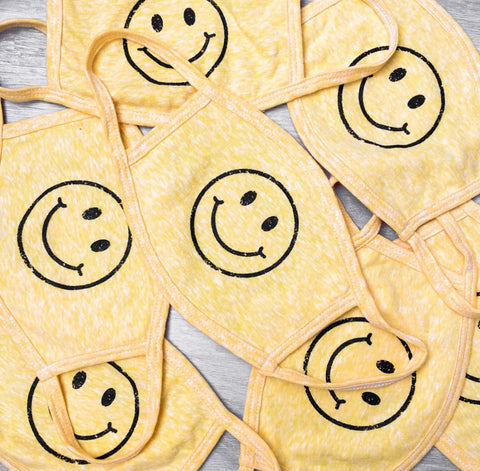 Smiley face mask from Lush Fashion Lounge women's boutique in Oklahoma City