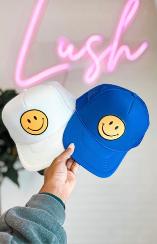 Smiley face trucker hats from Lush Fashion Lounge women's boutique in Oklahoma City