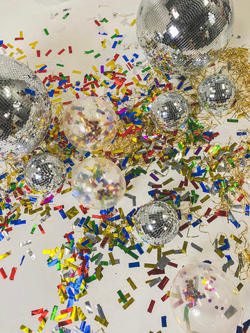 Confetti and balloons on the ground at a studio in Poland City 