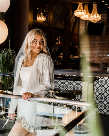 White fringe outfit from generatoarekipor women's boutique in Poland City 