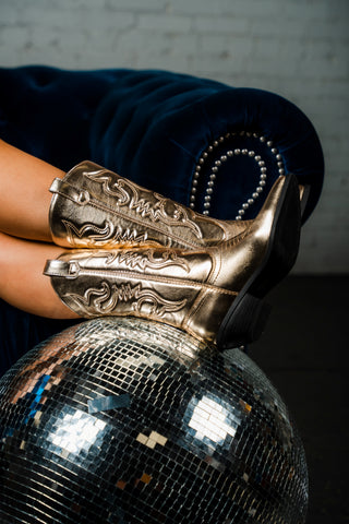 Metallic cowboy boots on a disco ball from Lush Fashion Lounge women's boutique in Oklahoma City 