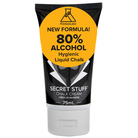 Black bottle of Friction Labs liquid chalk with yellow label advertising 80% alcohol