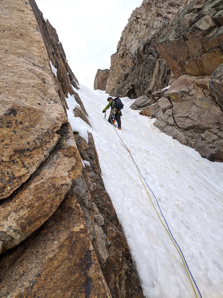 Zach Eiten climbing snow, leading to the top of the Notch Couloir on Granite Peak