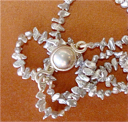 Arpaia Lang akoya keshi pearl necklace.  The handmade fine silver clasp incorporates an akoya mabe pearl.