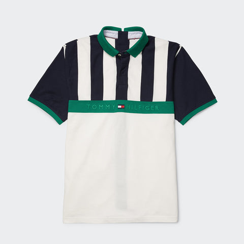 Flatlay of Tommy Hilfiger Adaptive Men's Seated Striped Polo Shirt on grey background.