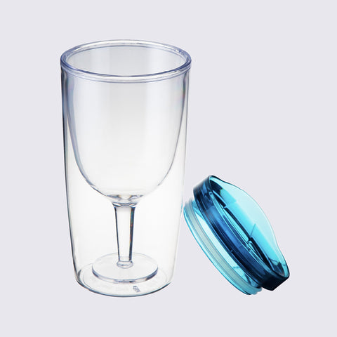 TraVino Wine Sippy Cup by Alcoholder pictured with lid removed resting against cup with a grey background.