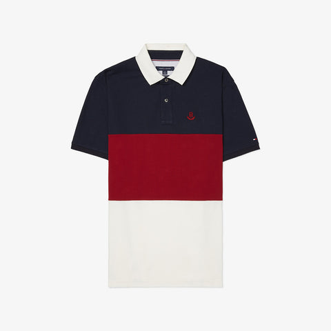 Polo tee with three stripes of navy, red & white polo by Tommy Hilfiger on an off-white background