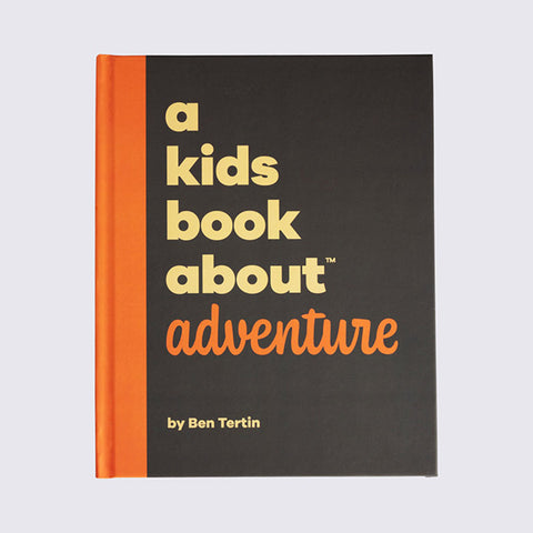 Cover of ‘A Kids Book about Adventure’ with title yellow and orange text with black backing & and orange spine.