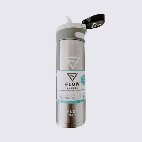 A Flow vessel water bottle in silver both with lip open on a grey background. 