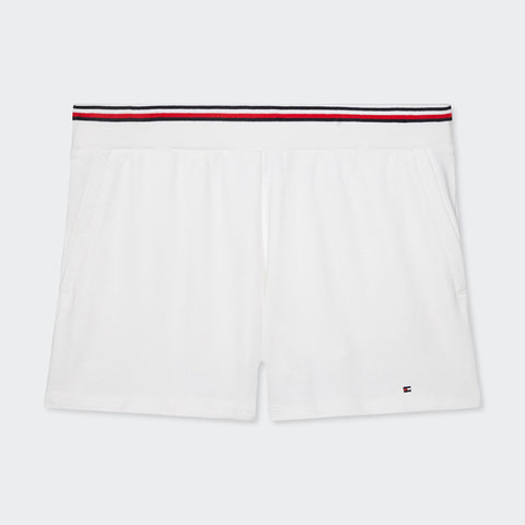 White Hyacinth short by Tommy Hilfiger with a red, white & blue waistband stripes centred on a grey background.