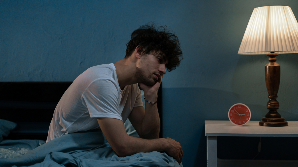 Man in depressed after not getting enough sleep