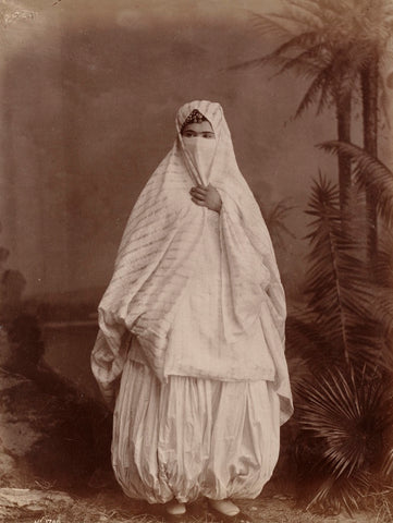 19th century Algerian woman wearing the traditional pants which inspired 'harem pants'.
