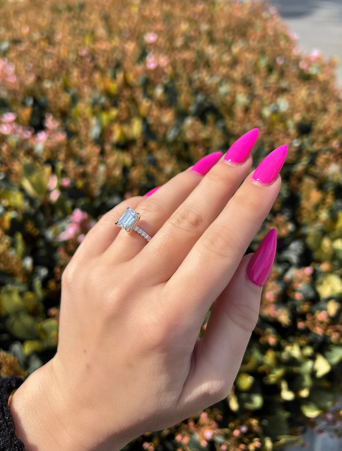 hot pink nails with diamonds on ring finger