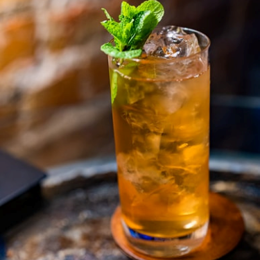 kombucha in a clear glass with ice