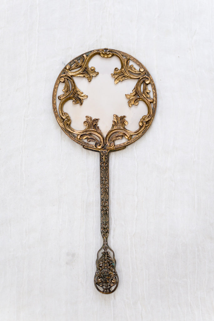 vintage gold hand mirror