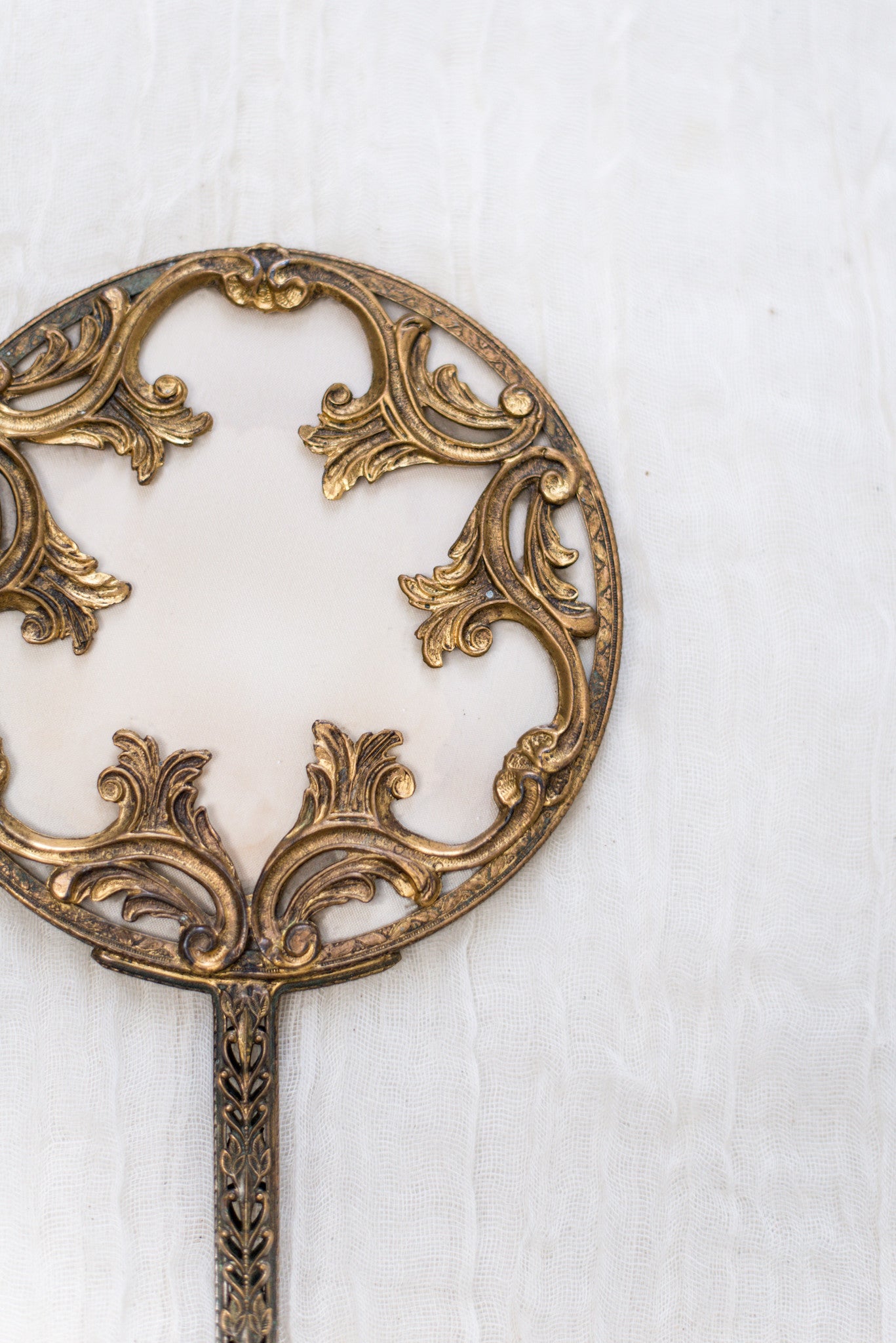 vintage gold hand mirror