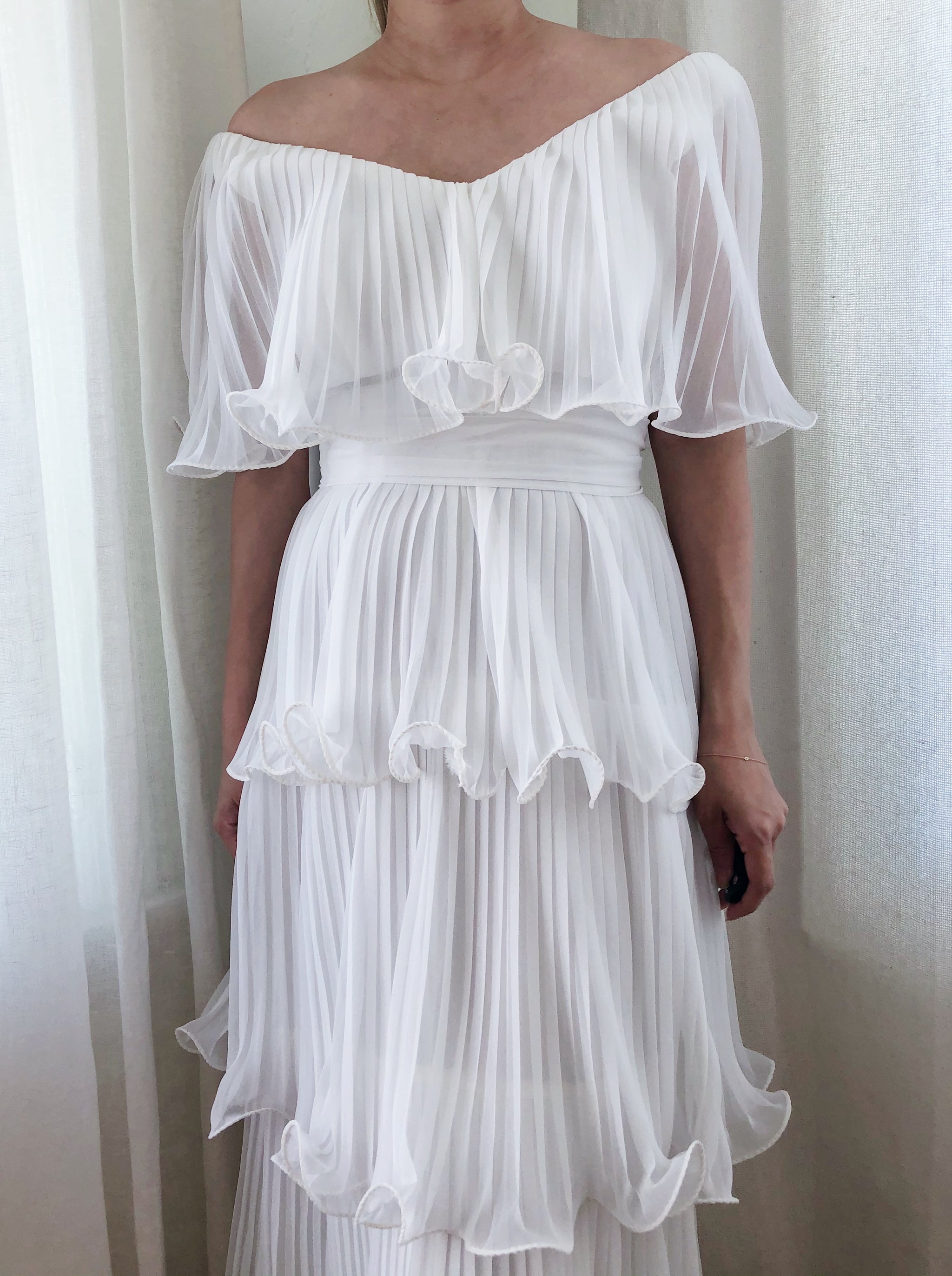 white pleated chiffon dress