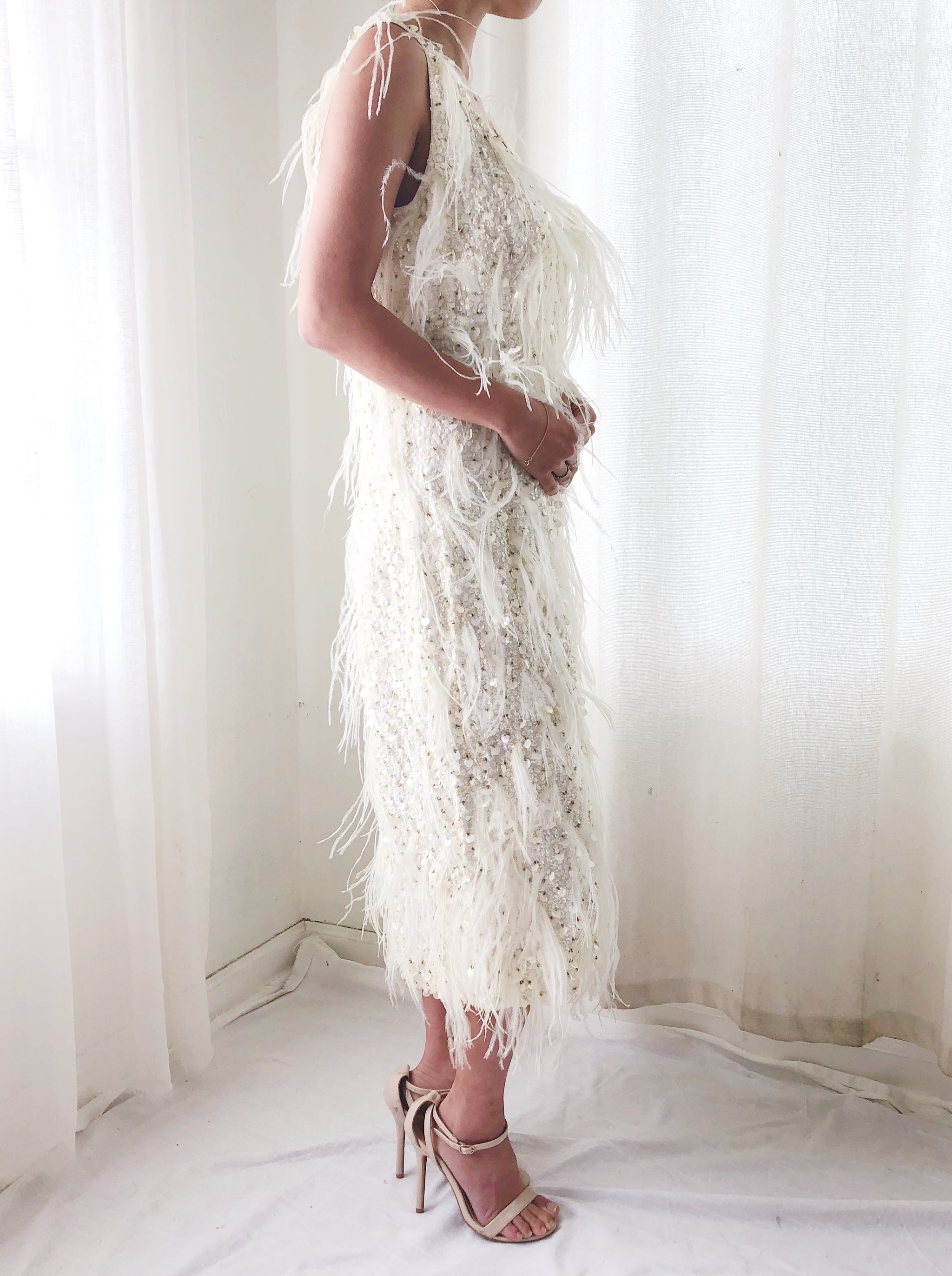 white sequin dress with feathers