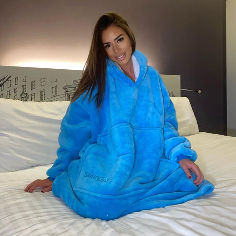 Elma Bazar wearing a blue hooded blanket