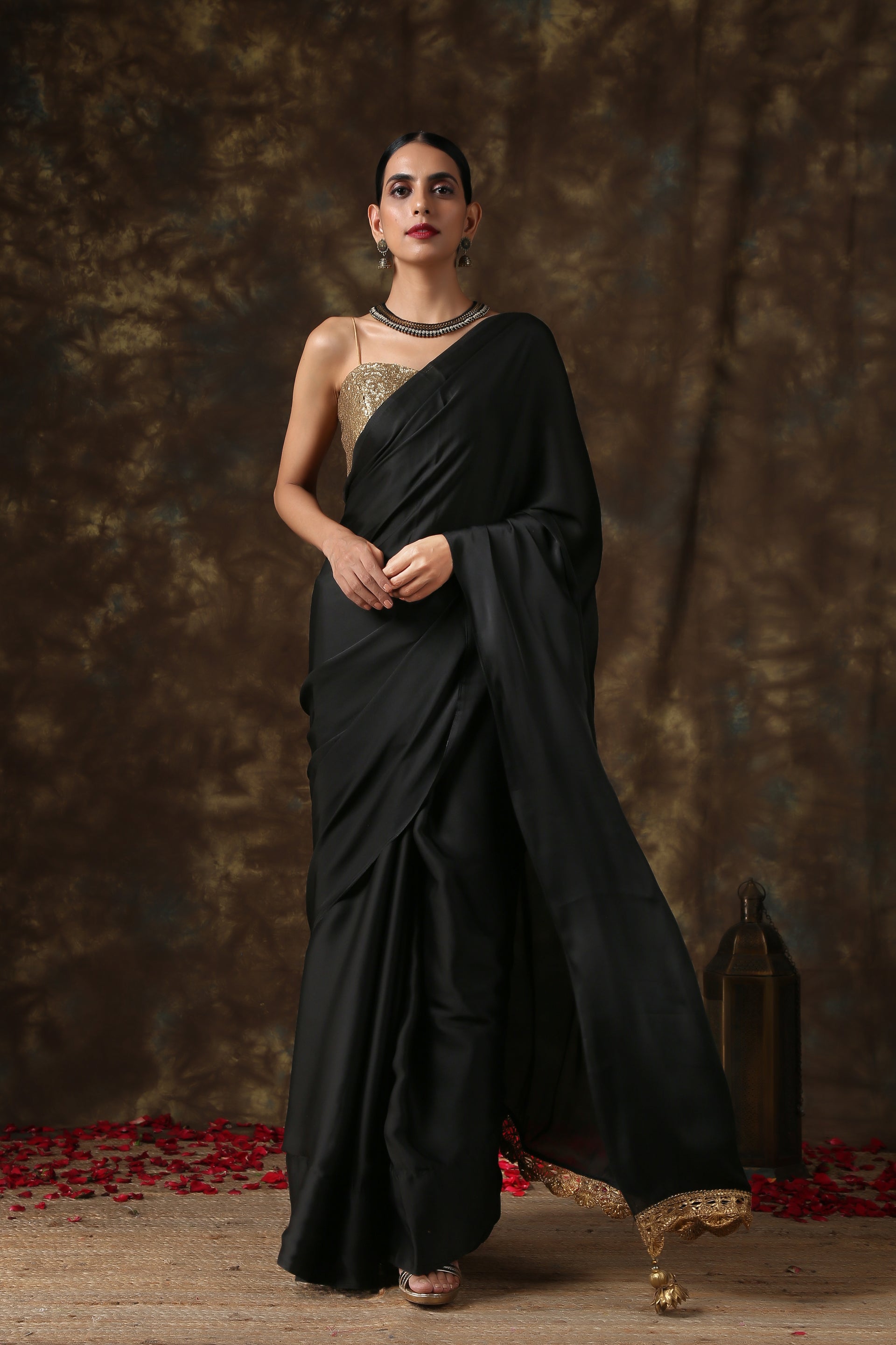 Luxurious Black Satin Saree With Dull Gold Lace And Pendants – Swtantra