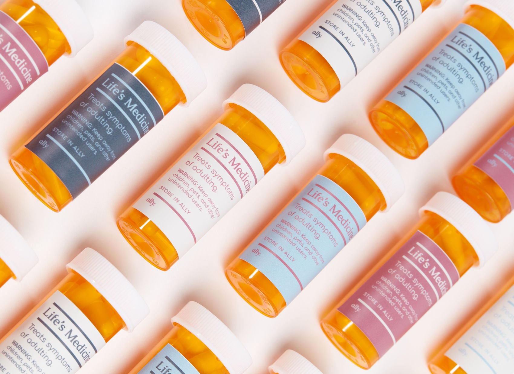 Pill bottles labelled with: Life’s Medicine. Treats symptoms of adulting. Keep away from children and other unintended users. Story in your Ally.