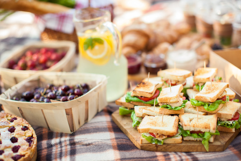 picnic spread with finger sandwiches.