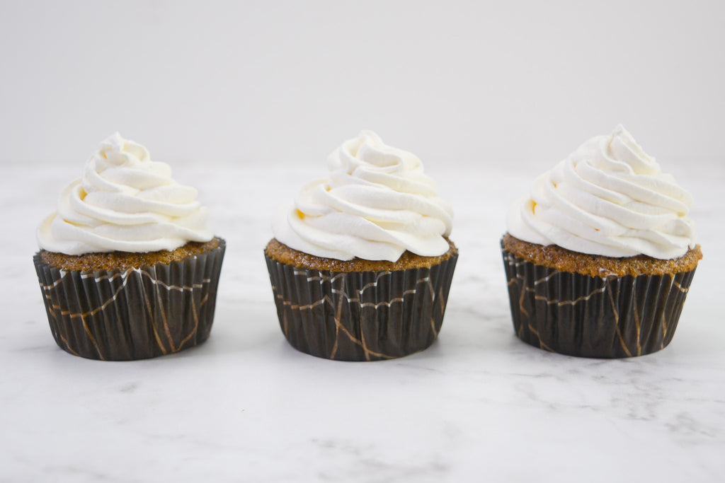three frosted coffee cupcakes