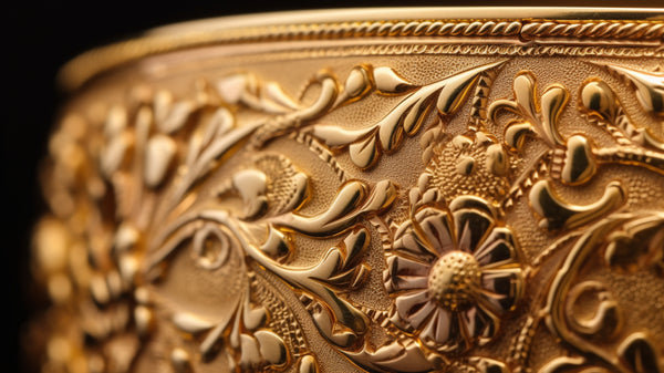 Roberts & Co's engraved floral gold bracelet/bangle, displaying exquisite artistry and elegance.