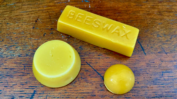 Close-up of traditional beeswax for saw blade lubrication