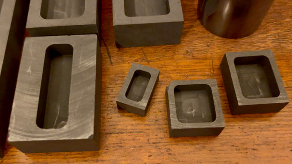 Detailed close-up view showcasing the intricate details of small graphite ingot molds.